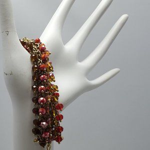 Ali Khan beaded bracelet with gold links. color topaz garnet ruby beads
